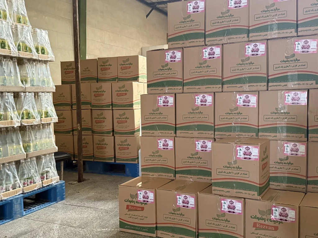 Rose water cartons in custom packaging in the warehouse of a rose water factory